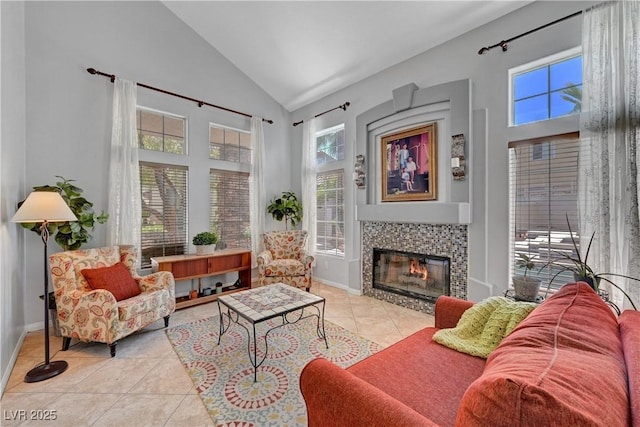 4651 Munich Ct, Las Vegas, NV 89147 - living area featuring light tile patterned floors, high vaulted ceiling, and a tiled fireplace