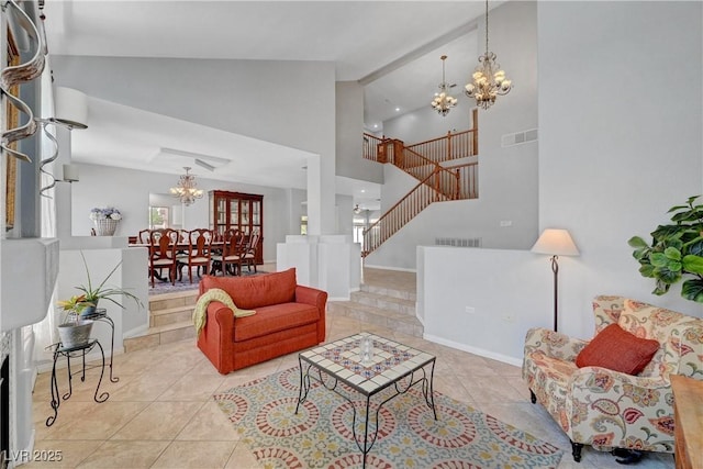 4651 Munich Ct, Las Vegas, NV 89147 - living room with a chandelier, high vaulted ceiling, light tile patterned flooring, and stairway