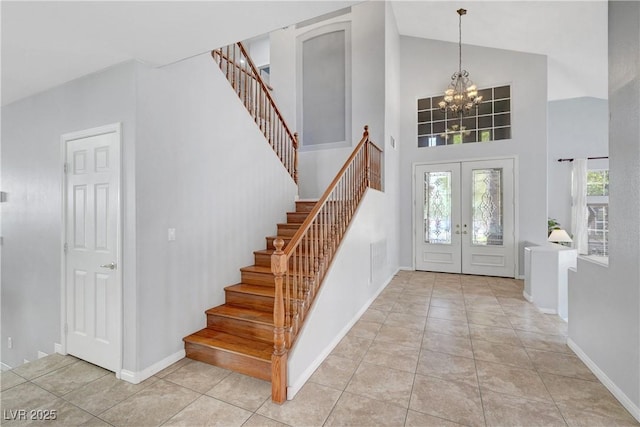 4651 Munich Ct, Las Vegas, NV 89147 - foyer entrance featuring stairway, plenty of natural light, french doors, high vaulted ceiling, and light tile patterned floors
