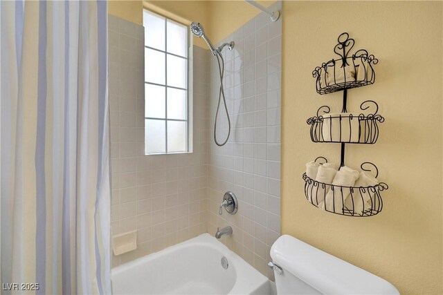 4651 Munich Ct, Las Vegas, NV 89147 - bathroom featuring shower / bathtub combination with curtain and plenty of natural light
