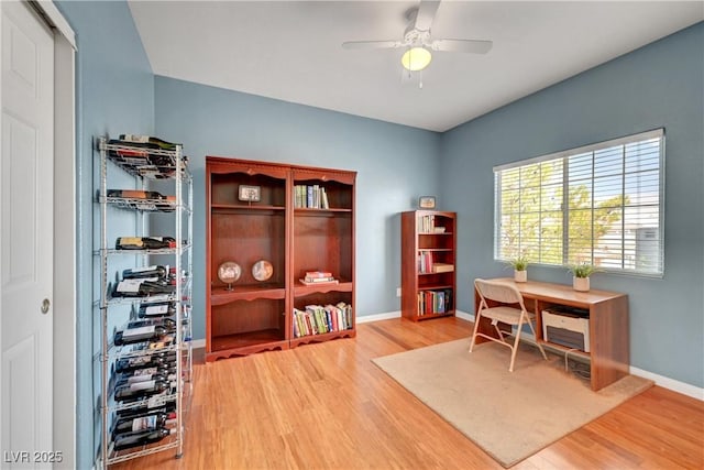 4651 Munich Ct, Las Vegas, NV 89147 - home office with light wood-style flooring and a ceiling fan