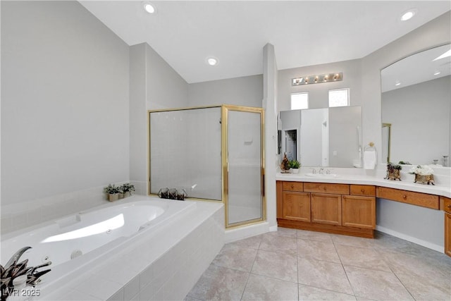 4651 Munich Ct, Las Vegas, NV 89147 - bathroom with vanity, a bath, a shower stall, and tile patterned floors