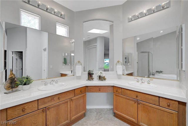 4651 Munich Ct, Las Vegas, NV 89147 - full bath featuring double vanity, a shower with door, a high ceiling, and tile patterned floors