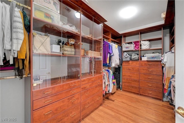 4651 Munich Ct, Las Vegas, NV 89147 - walk in closet with light wood-style floors