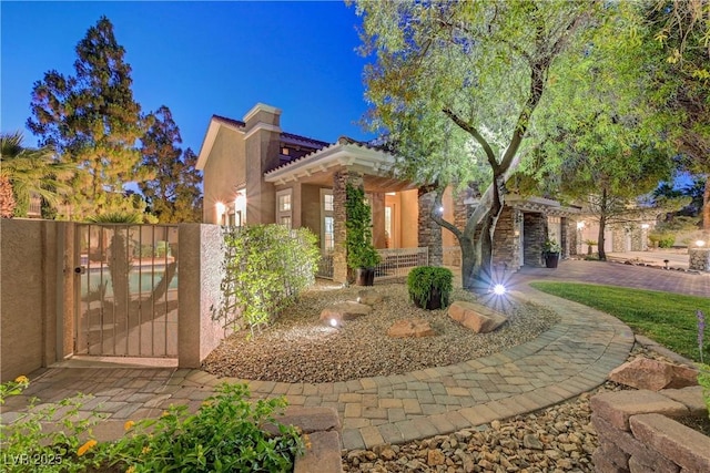 4651 Munich Ct, Las Vegas, NV 89147 - view of front of home featuring a gate, stucco siding, and a tiled roof