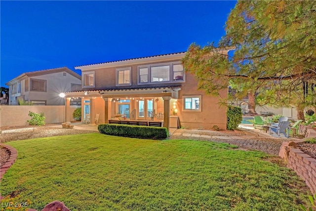 4651 Munich Ct, Las Vegas, NV 89147 - back of property featuring a patio and stucco siding