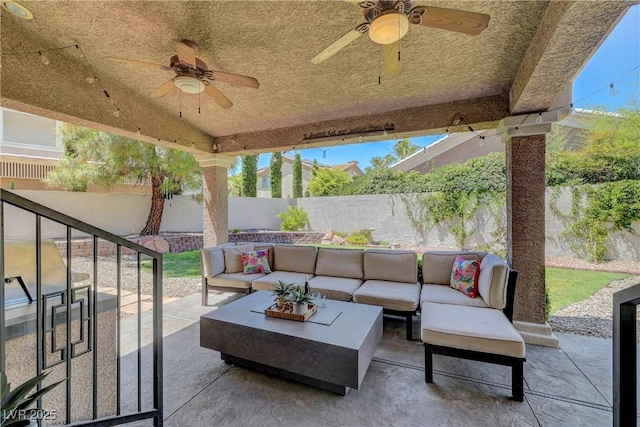4651 Munich Ct, Las Vegas, NV 89147 - fenced backyard with ceiling fan, a patio area, and an outdoor hangout area