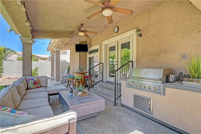 4651 Munich Ct, Las Vegas, NV 89147 - view of patio featuring french doors, an outdoor living space, an outdoor kitchen, and ceiling fan