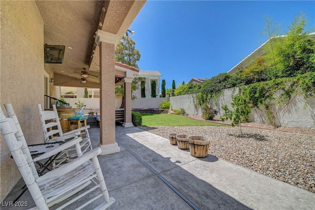 4651 Munich Ct, Las Vegas, NV 89147 - fenced backyard featuring ceiling fan and a patio area