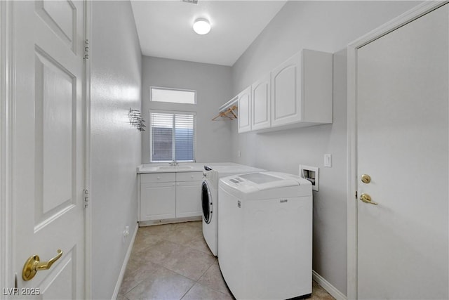 4651 Munich Ct, Las Vegas, NV 89147 - laundry room with cabinet space, washing machine and clothes dryer, and light tile patterned floors