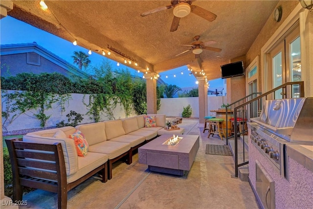 4651 Munich Ct, Las Vegas, NV 89147 - fenced backyard featuring an outdoor living space with a fire pit, a patio area, grilling area, and a ceiling fan