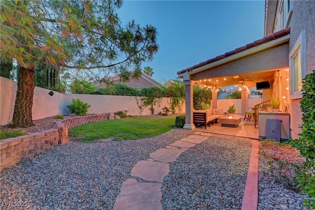 4651 Munich Ct, Las Vegas, NV 89147 - fenced backyard with an outdoor hangout area and a patio