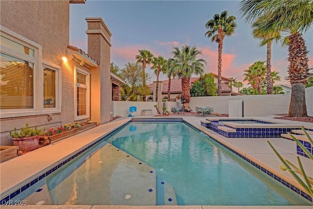 4651 Munich Ct, Las Vegas, NV 89147 - view of swimming pool with an in-ground hot tub, a fenced backyard, and a patio
