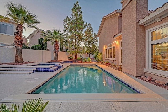 4651 Munich Ct, Las Vegas, NV 89147 - view of pool featuring a fenced backyard, a pool with connected hot tub, and a patio area