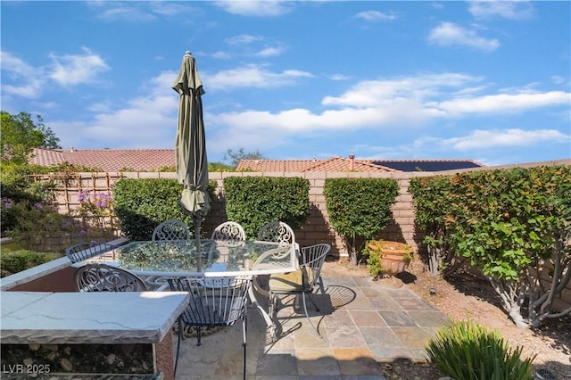 12276 Caminita Pl, Las Vegas, NV 89138 - fenced backyard featuring a patio and outdoor dining area