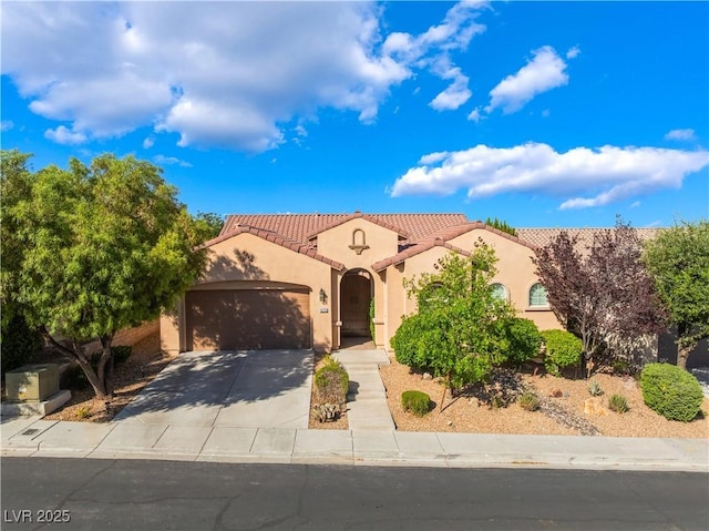 12276 Caminita Pl, Las Vegas, NV 89138 - mediterranean / spanish home featuring an attached garage, stucco siding, driveway, and a tiled roof