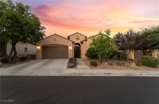 12276 Caminita Pl, Las Vegas, NV 89138 - mediterranean / spanish-style house featuring concrete driveway, an attached garage, and stucco siding