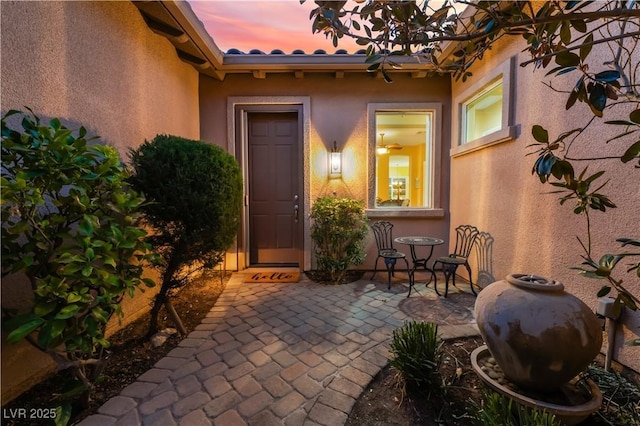 12276 Caminita Pl, Las Vegas, NV 89138 - doorway to property with a patio and stucco siding