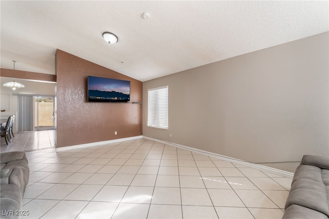 6224 Mandarin Dr, Las Vegas, NV 89108 - living area with vaulted ceiling, plenty of natural light, a chandelier, a textured ceiling, and light tile patterned floors