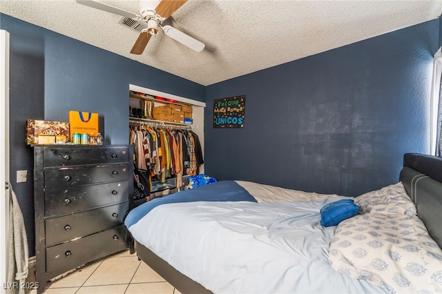 6224 Mandarin Dr, Las Vegas, NV 89108 - tiled bedroom featuring a closet, a textured ceiling, and ceiling fan