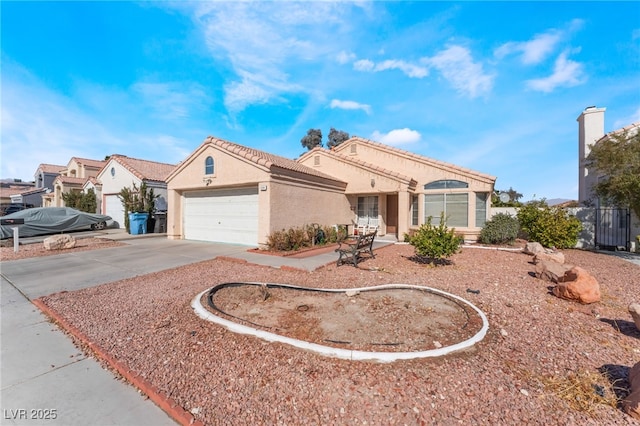 6224 Mandarin Dr, Las Vegas, NV 89108 - view of front facade with concrete driveway, an attached garage, and stucco siding
