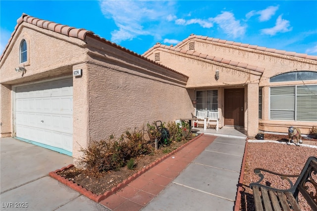 6224 Mandarin Dr, Las Vegas, NV 89108 - entrance to property with stucco siding, driveway, and a garage