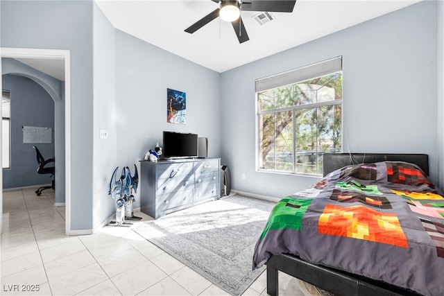 109 Breezy Tree Ct Unit 202, Las Vegas, NV 89145 - bedroom with a ceiling fan, marble finish flooring, and arched walkways