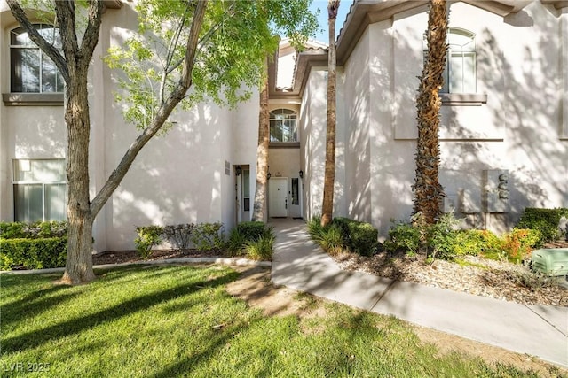 109 Breezy Tree Ct Unit 202, Las Vegas, NV 89145 - entrance to property featuring stucco siding and a yard