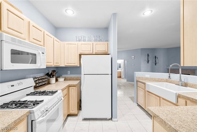 109 Breezy Tree Ct Unit 202, Las Vegas, NV 89145 - kitchen featuring white appliances, light brown cabinets, arched walkways, light countertops, and light tile patterned floors
