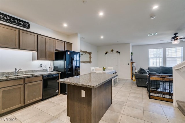 1200 Mission View Ct, Henderson, NV 89002 - kitchen with black appliances, stone countertops, a center island, open floor plan, and recessed lighting