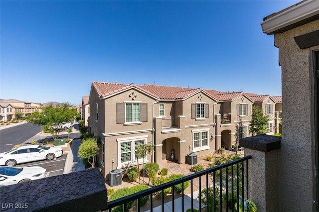 1200 Mission View Ct, Henderson, NV 89002 - view of front facade featuring a balcony, a residential view, stucco siding, a tile roof, and uncovered parking