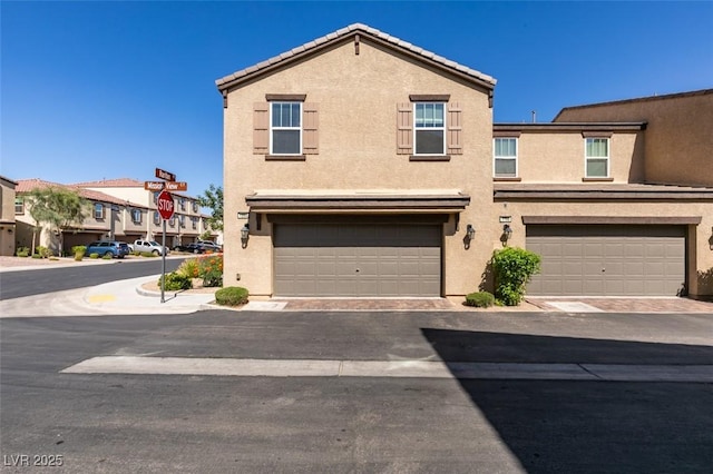 1200 Mission View Ct, Henderson, NV 89002 - townhome / multi-family property featuring stucco siding and a garage