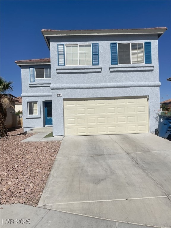 8484 Montana Stream Ave, Las Vegas, NV 89113 - view of front of house with a garage, concrete driveway, and stucco siding