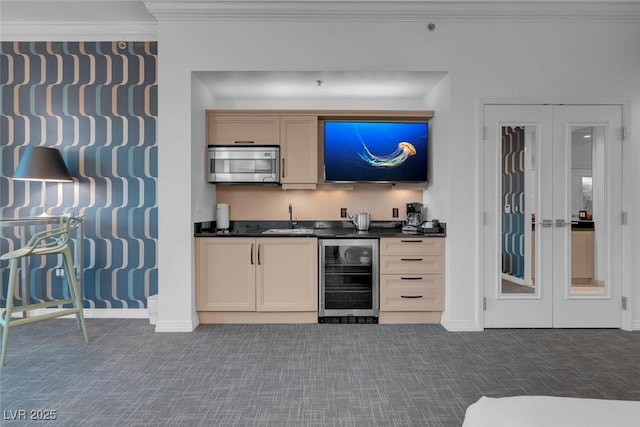145 E Harmon Ave Unit 3705, Las Vegas, NV 89109 - indoor wet bar with beverage cooler, stainless steel microwave, carpet, and ornamental molding
