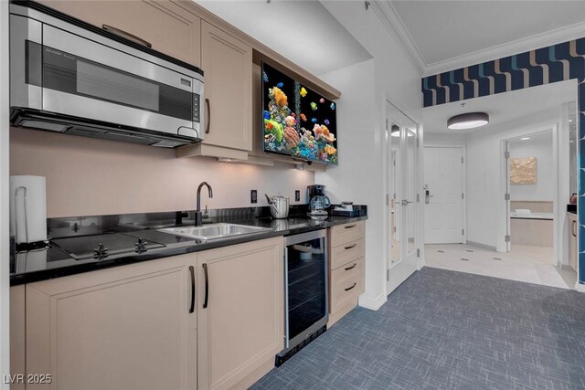 145 E Harmon Ave Unit 3705, Las Vegas, NV 89109 - kitchen with stainless steel microwave, beverage cooler, dark countertops, crown molding, and dark carpet