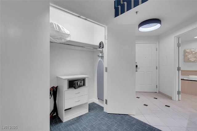 145 E Harmon Ave Unit 3705, Las Vegas, NV 89109 - laundry room with tile patterned floors