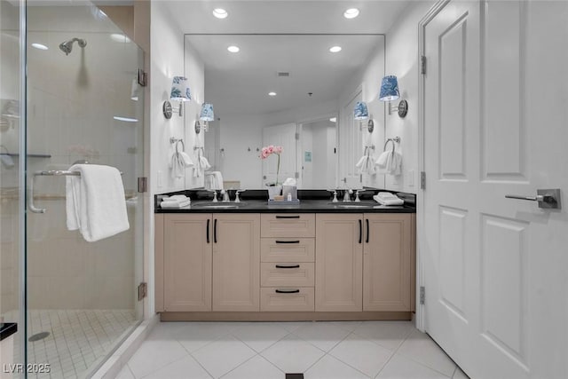 145 E Harmon Ave Unit 3705, Las Vegas, NV 89109 - bathroom with double vanity, a shower stall, recessed lighting, and tile patterned floors
