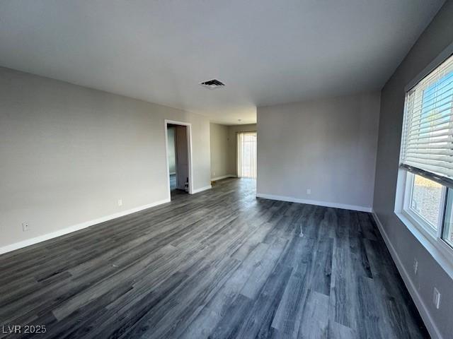7144 Forest Vista St, Las Vegas, NV 89147 - unfurnished room with plenty of natural light and dark wood-style floors
