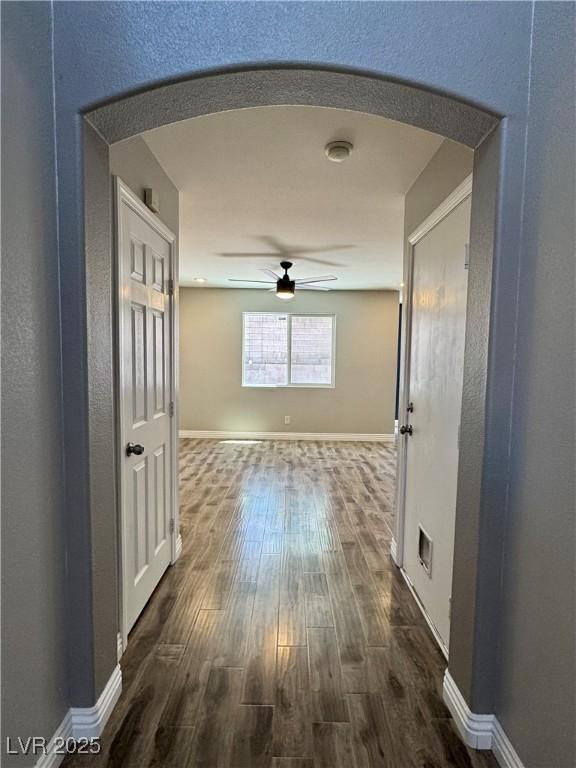 9165 Beauchamp Ave, Las Vegas, NV 89148 - hall featuring arched walkways and dark wood-type flooring