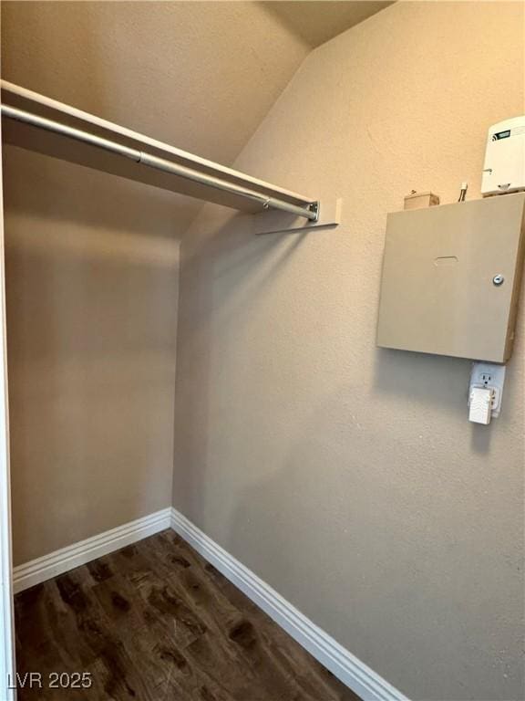 9165 Beauchamp Ave, Las Vegas, NV 89148 - spacious closet featuring vaulted ceiling and dark wood-style floors