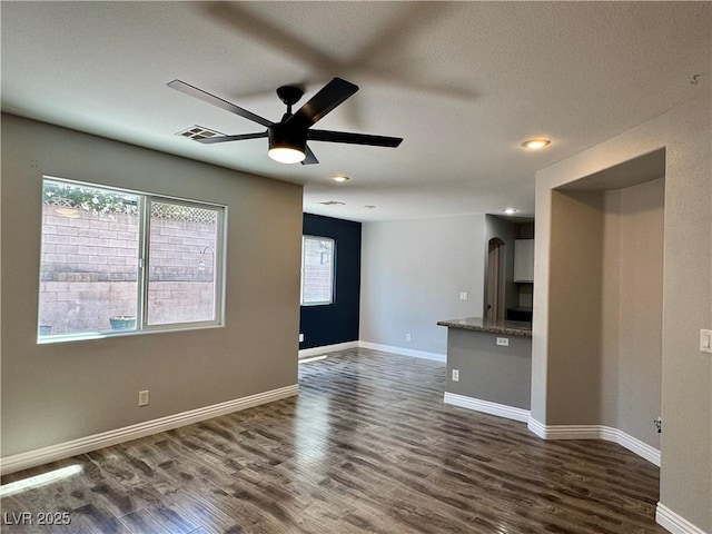 9165 Beauchamp Ave, Las Vegas, NV 89148 - unfurnished living room featuring ceiling fan, dark wood-style flooring, and recessed lighting