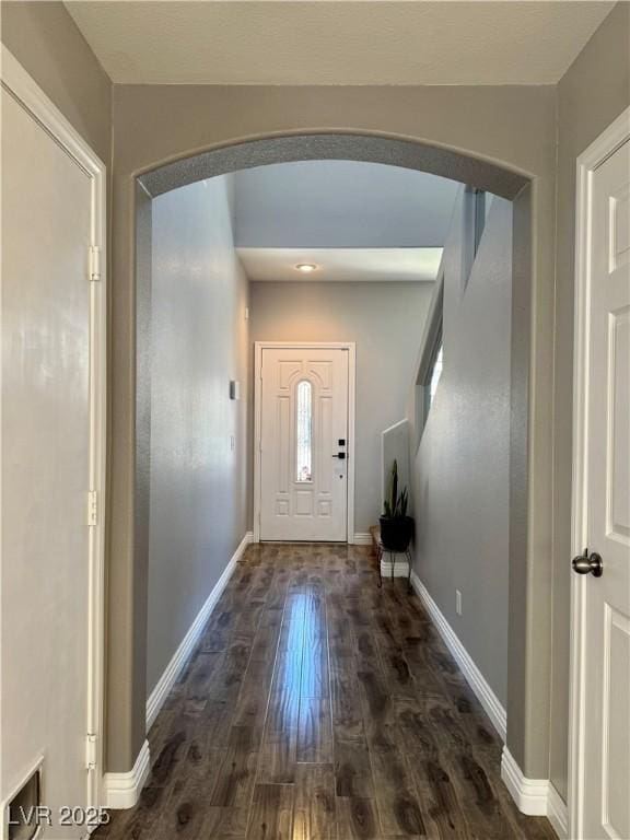 9165 Beauchamp Ave, Las Vegas, NV 89148 - entrance foyer with arched walkways and dark wood-type flooring