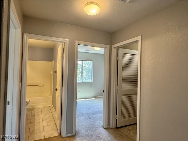 9165 Beauchamp Ave, Las Vegas, NV 89148 - hallway with light colored carpet and baseboards