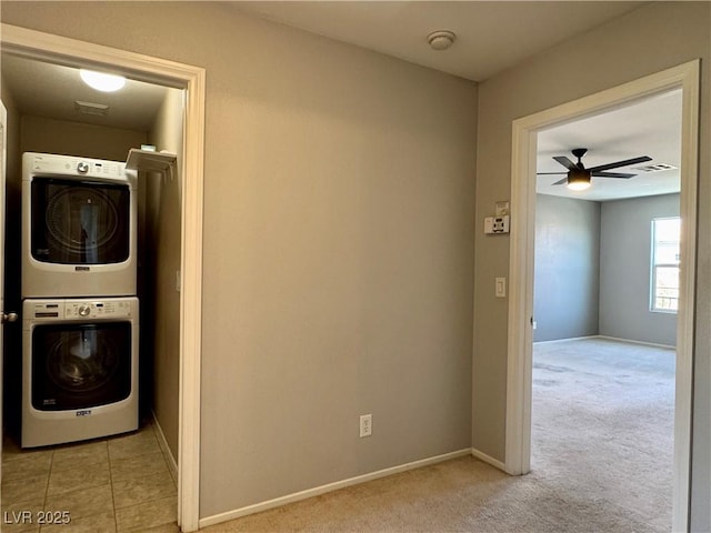 9165 Beauchamp Ave, Las Vegas, NV 89148 - laundry area with stacked washer / dryer, a ceiling fan, and light colored carpet