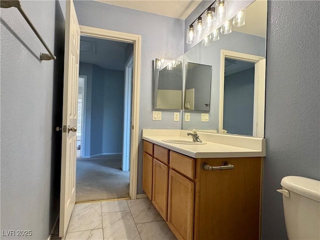9165 Beauchamp Ave, Las Vegas, NV 89148 - bathroom with marble look tile flooring, vanity, and a textured wall