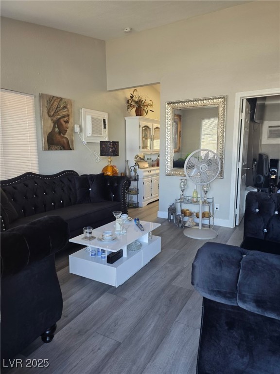 1713 Fairfield Ave, Las Vegas, NV 89102 - living area featuring wood finished floors and a wall mounted AC