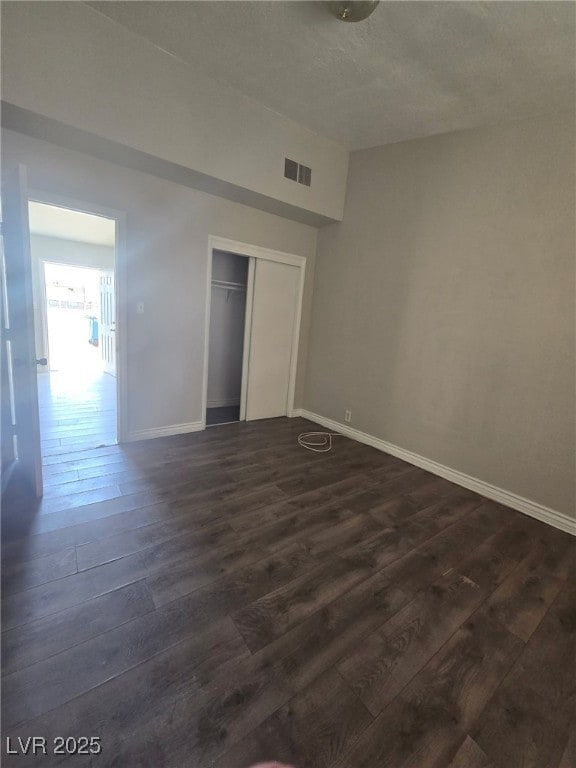 1713 Fairfield Ave, Las Vegas, NV 89102 - unfurnished bedroom featuring dark wood-style floors and a closet