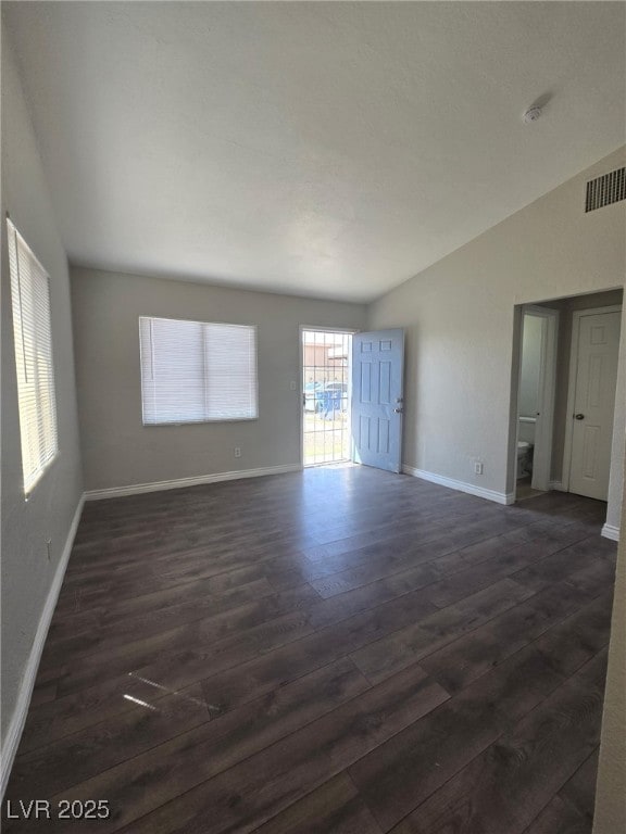 1713 Fairfield Ave, Las Vegas, NV 89102 - unfurnished room featuring lofted ceiling and dark wood finished floors
