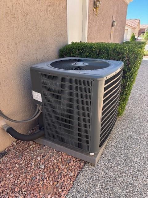 10036 Keysborough Dr, Las Vegas, NV 89134 - exterior view of a cooling unit and stucco siding