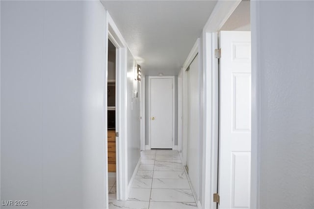 6317 Alta Dr, Las Vegas, NV 89107 - corridor with light marble finish floors and baseboards
